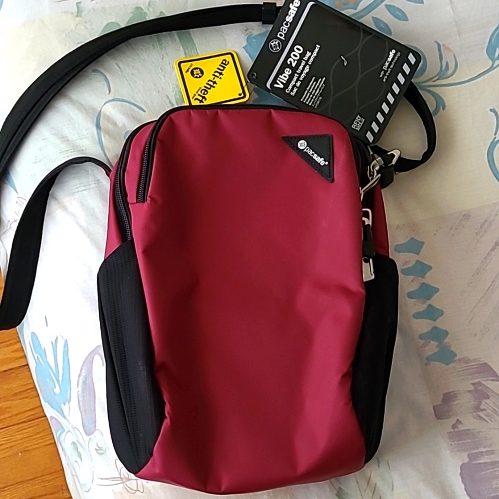 NWT Pacsafe sling bag, dark fuchsia, 7.5L